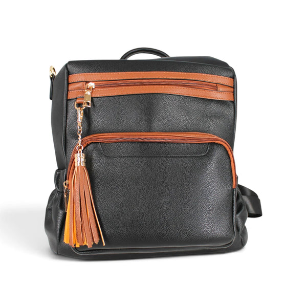 Sac à dos Maison Taïga bicolore noir et cognac avec fermetures éclair et pompon décoratif, style urbain élégant