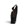 Sac bandoulière Maison Taïga noir et cognac en vue latérale, format vertical compact avec fermetures éclair contrastées
