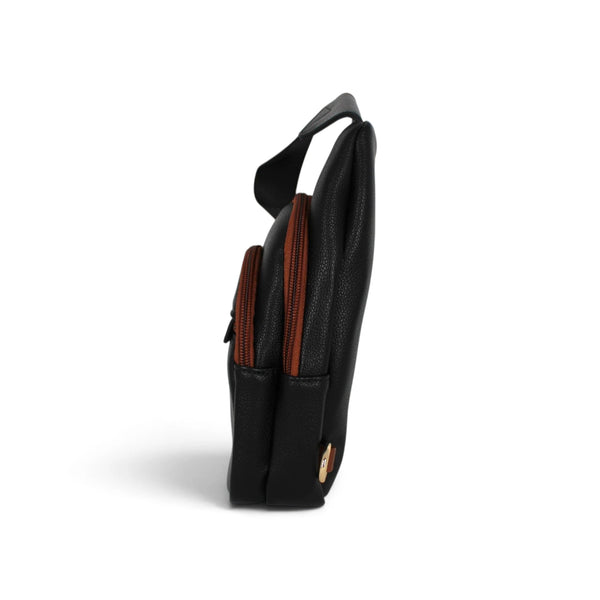 Sac bandoulière Maison Taïga noir et cognac en vue latérale, format vertical compact avec fermetures éclair contrastées